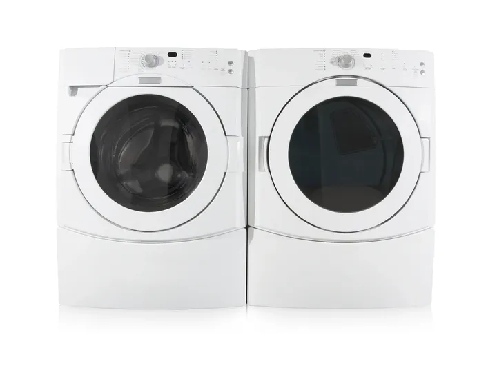 A washer and dryer sitting next to each other.